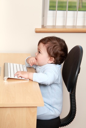 Baby working on computer