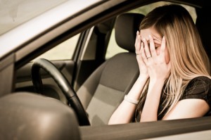 In troubles - unhappy woman in car